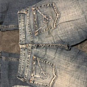 BEBE DENIM DISTRESSED JEANS